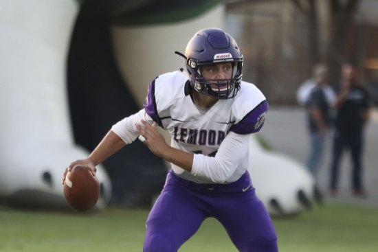 Lemoore's Justin Holaday scrambles in Friday night's 35-0 loss to Clovis East. The Tigers hope to end a losing streak Friday night in Chowchilla.